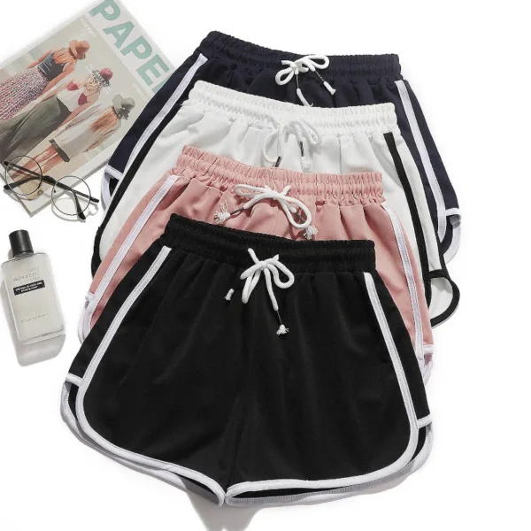 Shorts leve e respirável para uso externo e academia. Modelagem reta e solta. Cintura média, tecido macio. Cores: preto, branco, cinza, rosa, roxo, azul, vermelho.